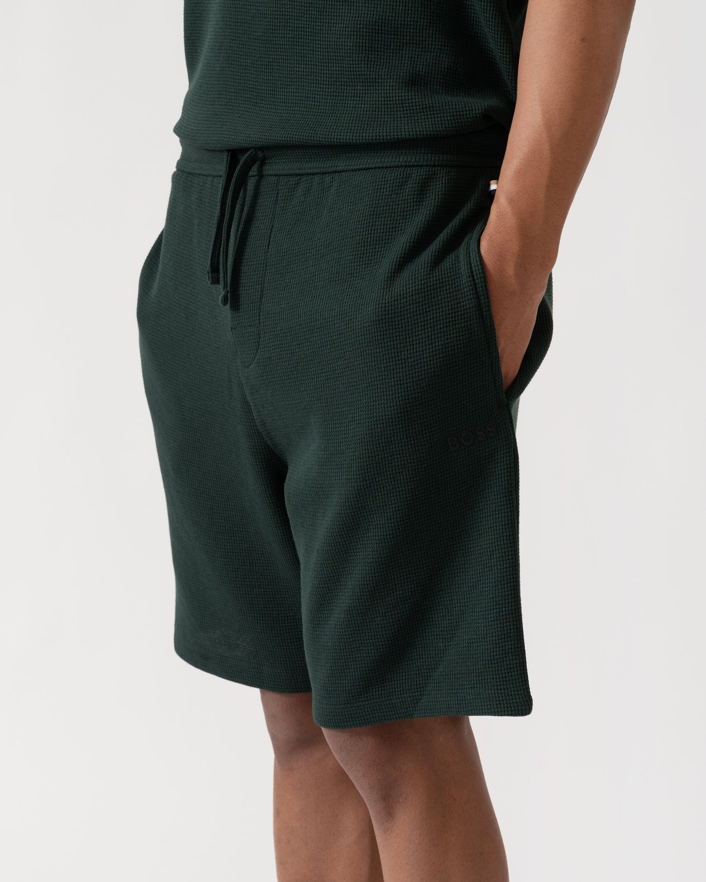 Detail shot of BOSS Orange Waffle Mens Cotton Blend Waffle Structure Pyjama Shorts with Embroidered Logo - Dark Green 308