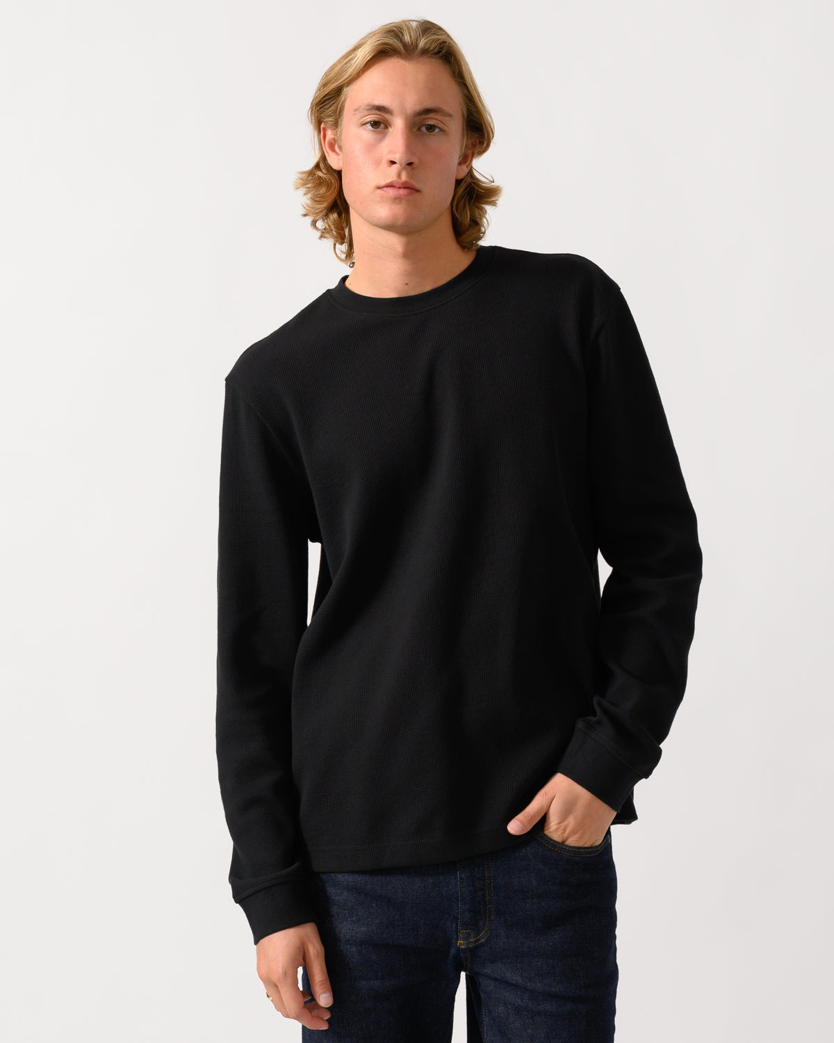 studio photograph of a model wearing a BOSS Orange We Tempest Mens Crew Neck Sweatshirt in Black 001