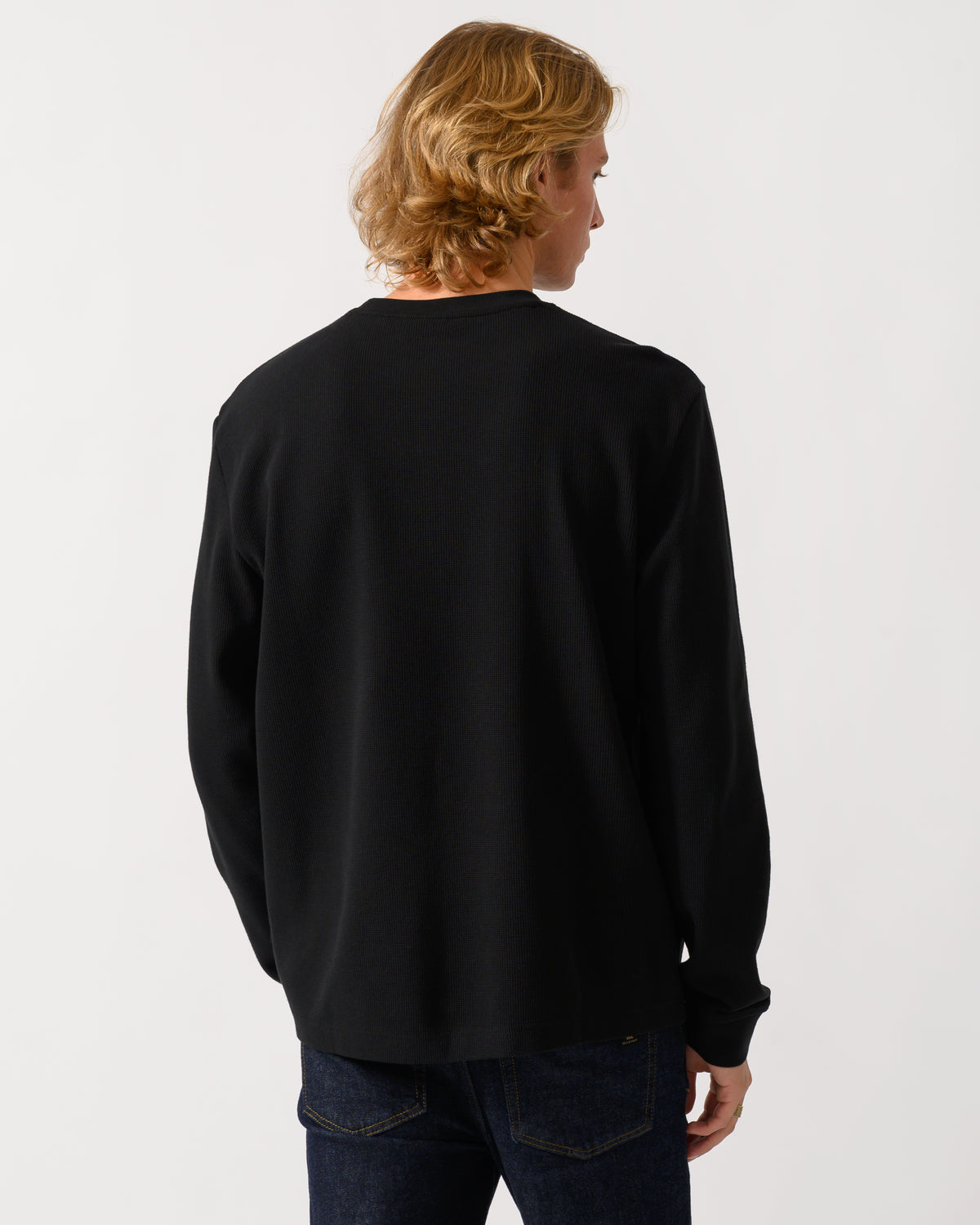 studio photograph of the back of a model wearing a BOSS Orange We Tempest Mens Crew Neck Sweatshirt in Black 001