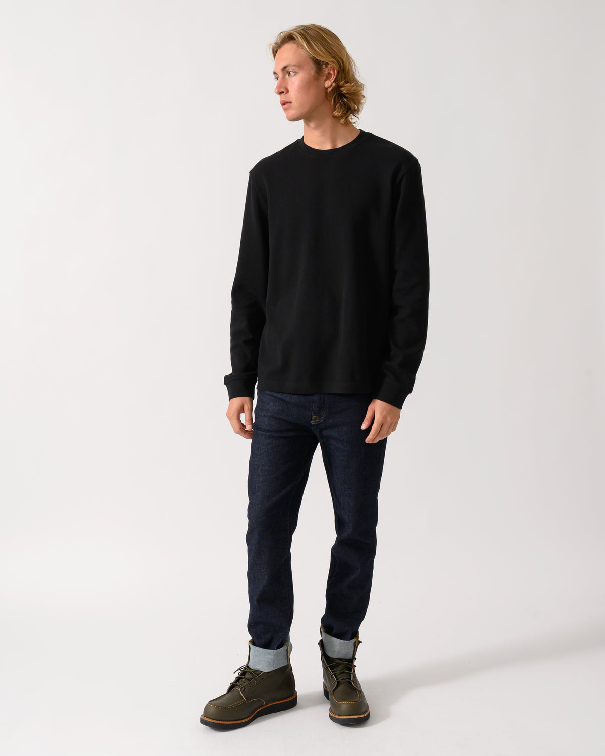 full length studio photograph of a model wearing a BOSS Orange We Tempest Mens Crew Neck Sweatshirt in Black 001