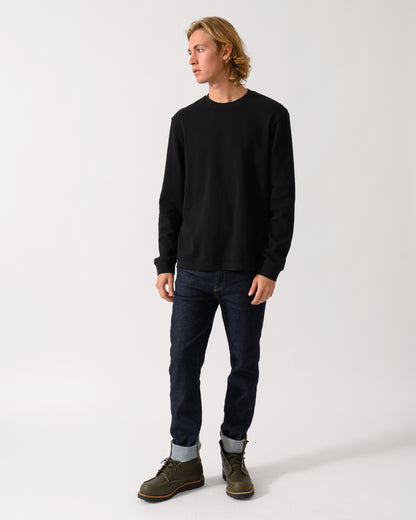 full length studio photograph of a model wearing a BOSS Orange We Tempest Mens Crew Neck Sweatshirt in Black 001