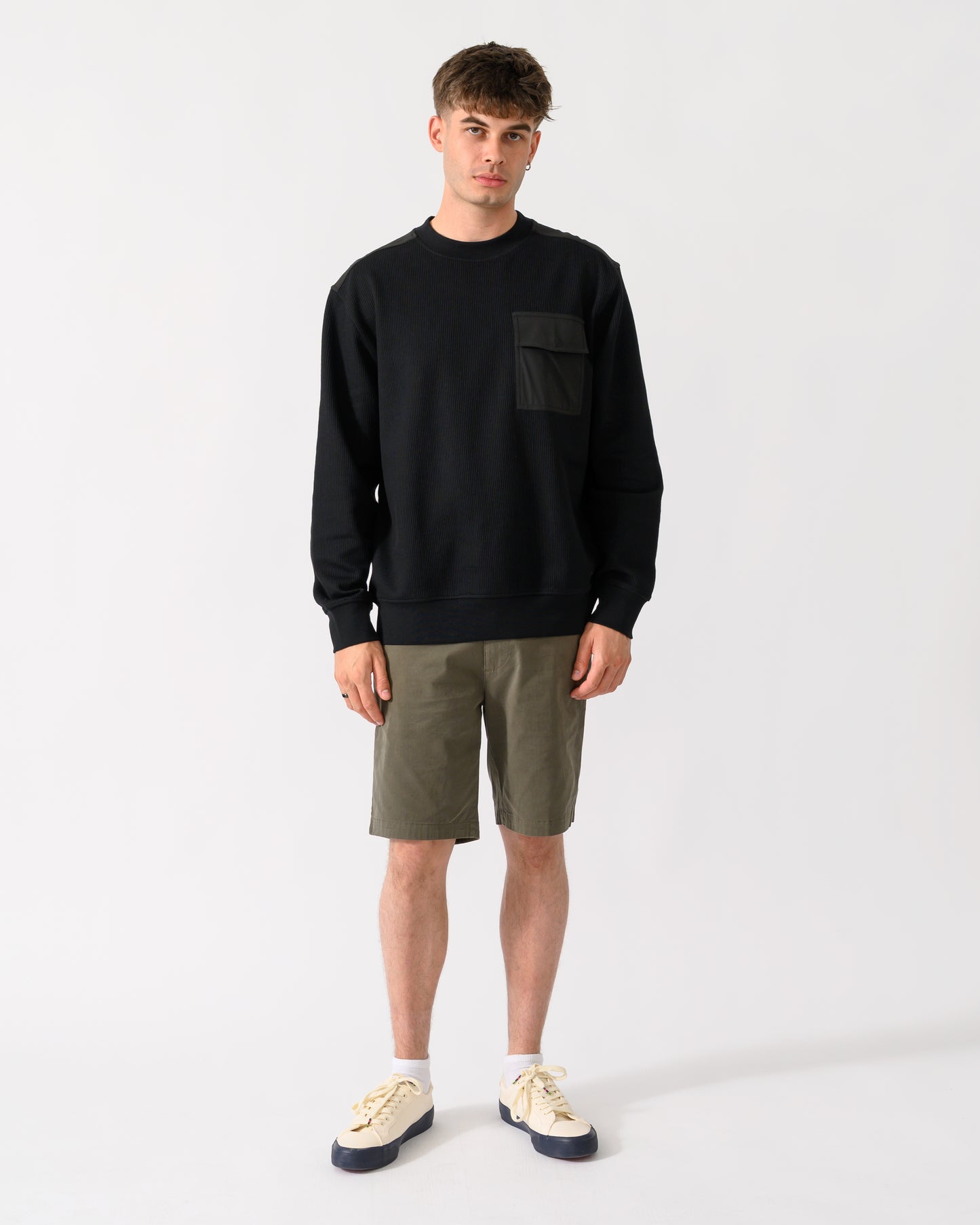 full length shot of a model wearing a BOSS Orange We Urban Mens Crew Neck Sweatshirt with Pocket in Black 001