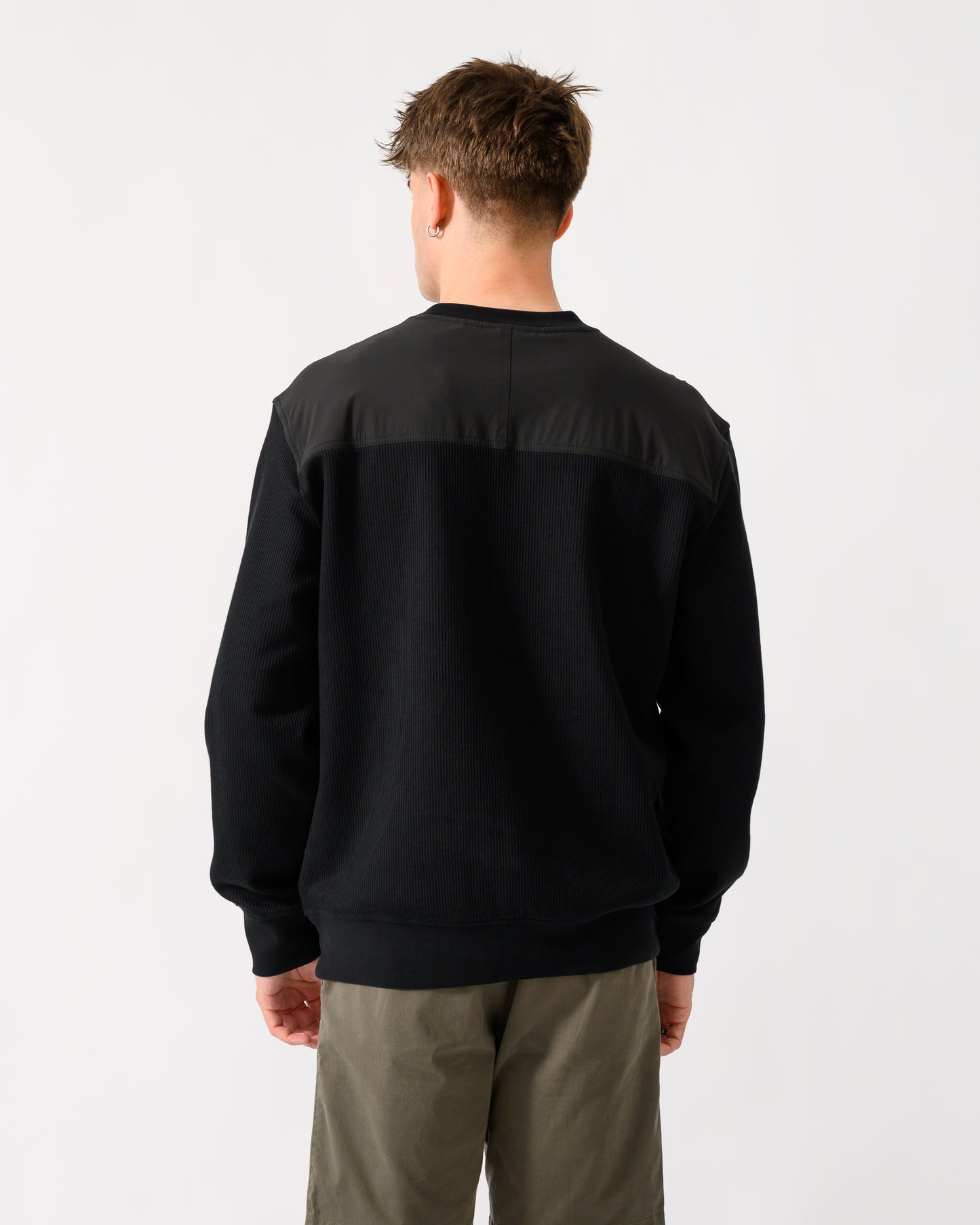 back shot of a model wearing a BOSS Orange We Urban Mens Crew Neck Sweatshirt with Pocket in Black 001