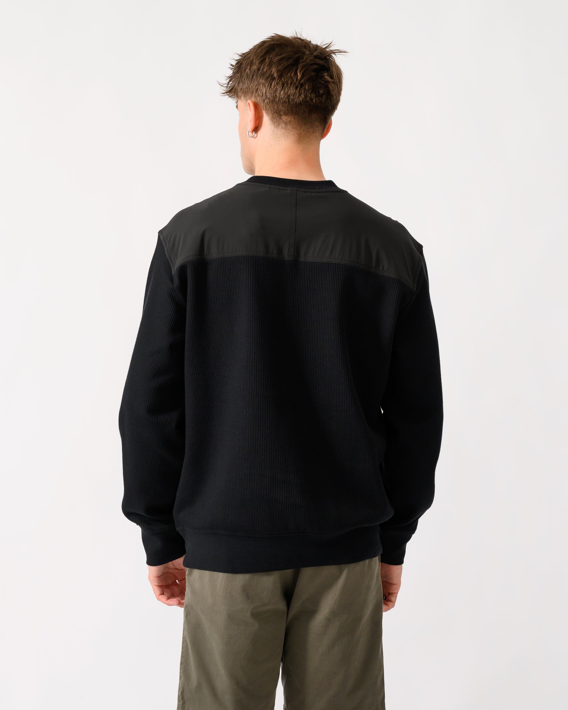 back shot of a model wearing a BOSS Orange We Urban Mens Crew Neck Sweatshirt with Pocket in Black 001