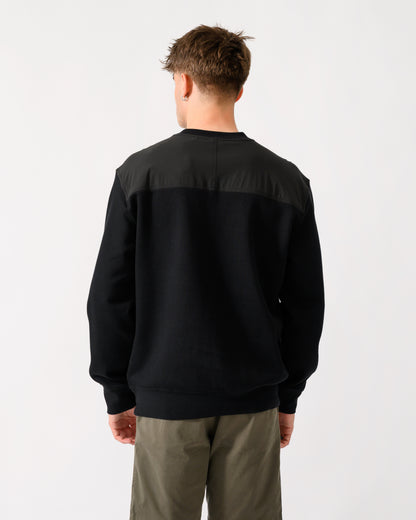 back shot of a model wearing a BOSS Orange We Urban Mens Crew Neck Sweatshirt with Pocket in Black 001