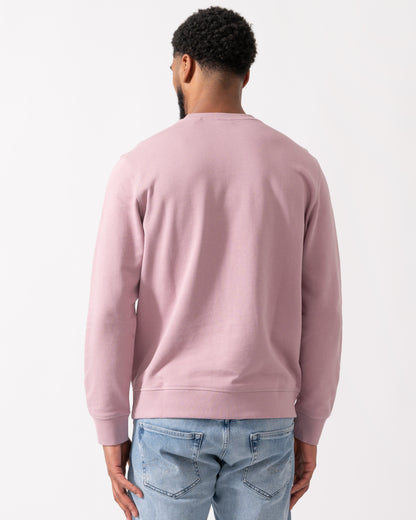 back shot of a model wearing a BOSS Orange Westart Mens Crew Neck Sweatshirt With Logo Patch in Light Pastel Purple