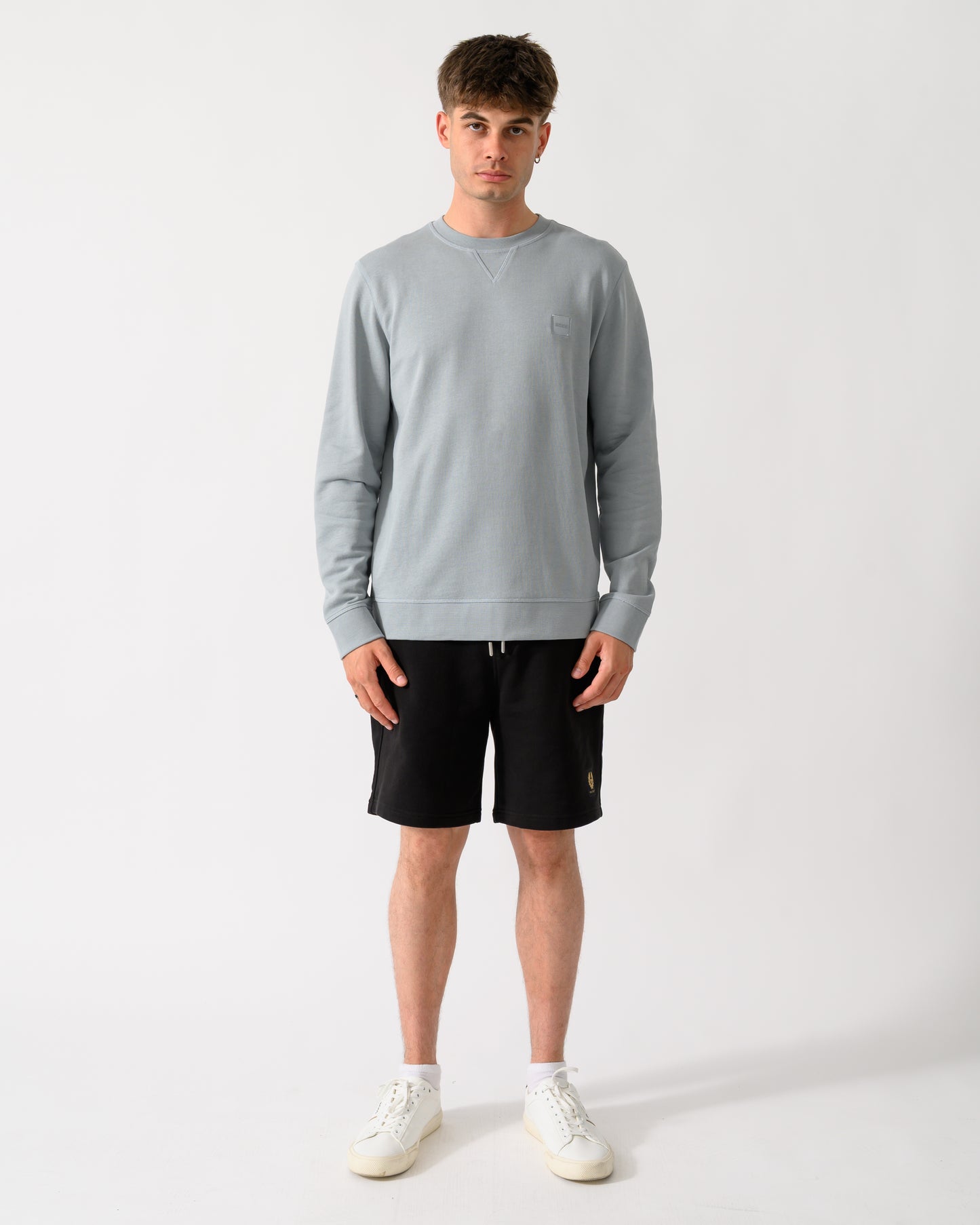 full length shot of a model wearing a BOSS Orange Westart Mens Crew Neck Sweatshirt With Logo Patch in Open Grey 084