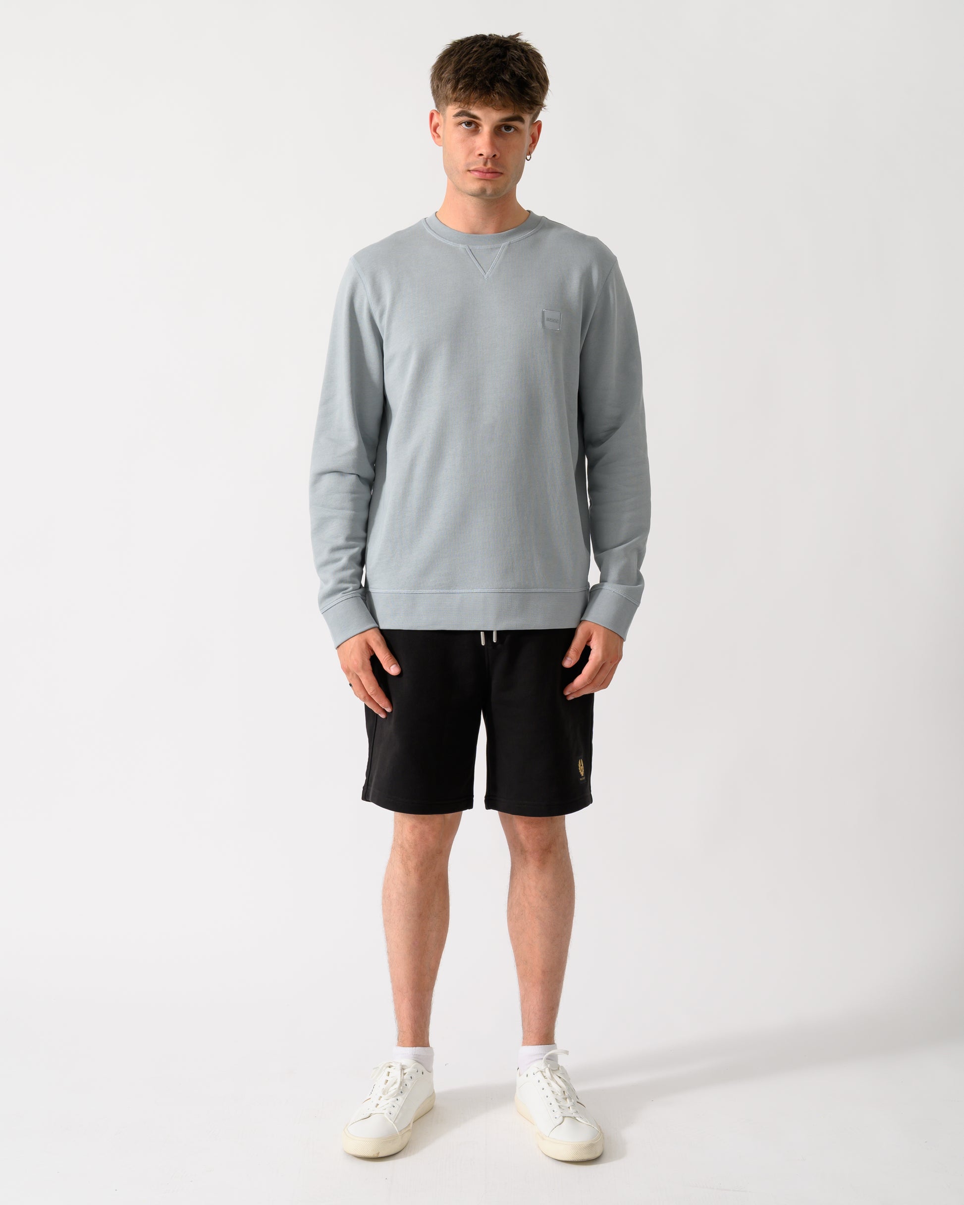 full length shot of a model wearing a BOSS Orange Westart Mens Crew Neck Sweatshirt With Logo Patch in Open Grey 084