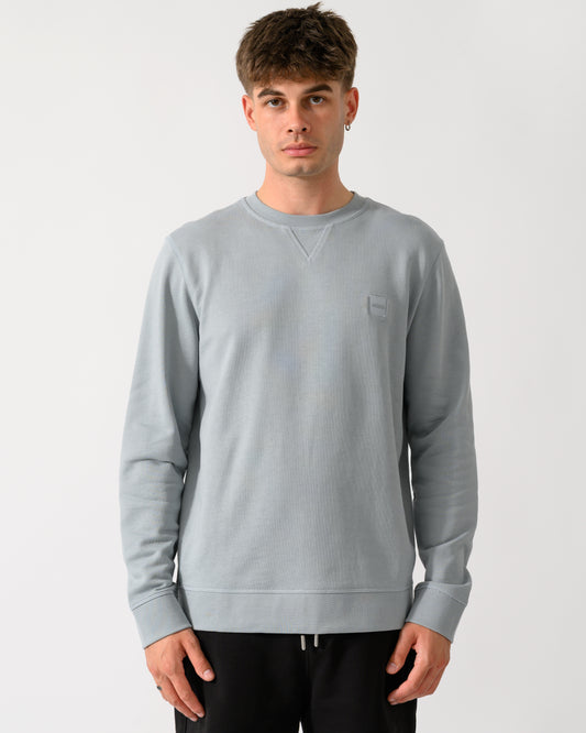 model wearing a BOSS Orange Westart Mens Crew Neck Sweatshirt With Logo Patch in Open Grey 084