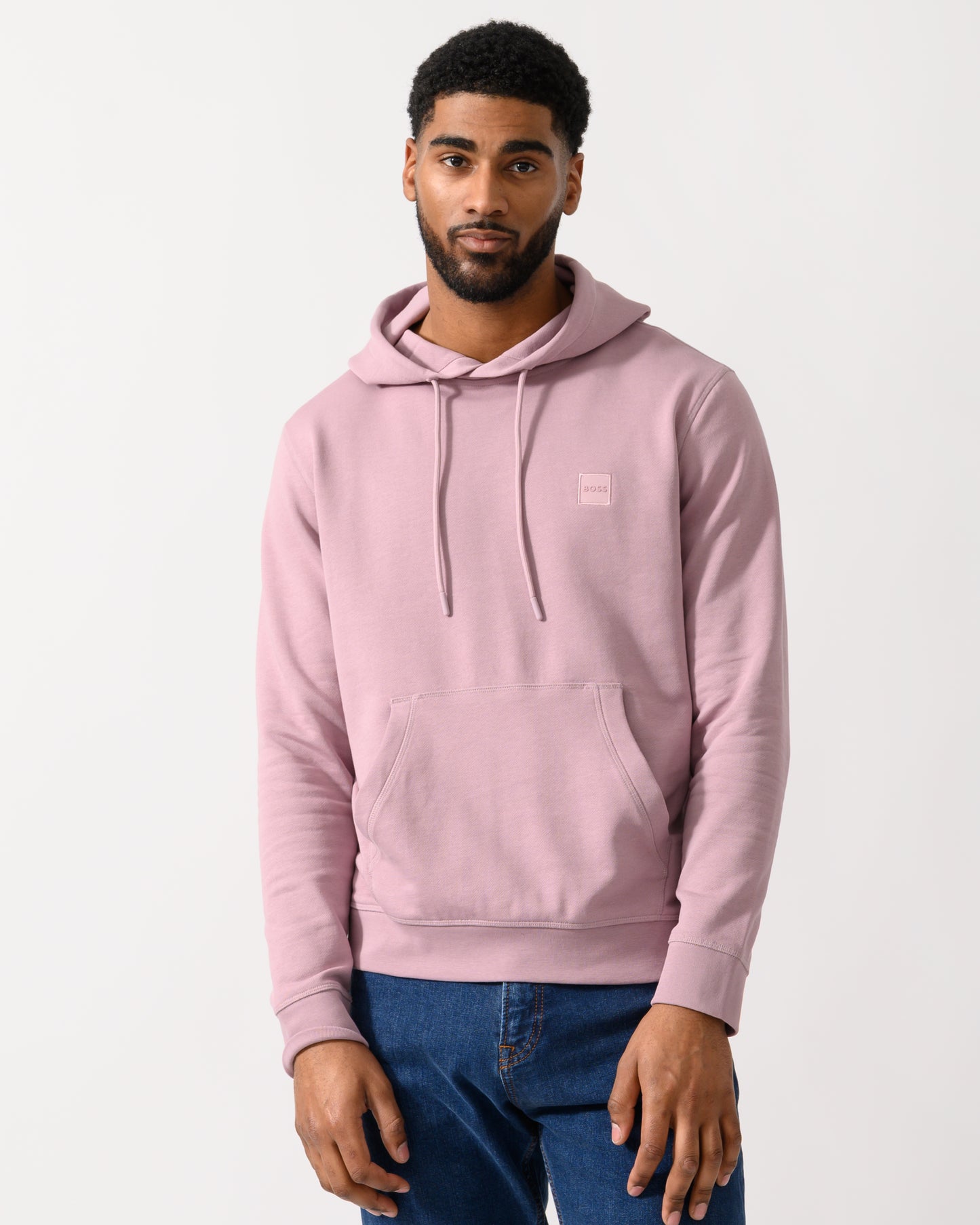 Model wearing a BOSS Orange Wetalk Mens Pullover Hoodie With Logo Patch in Light/Pastel Purple