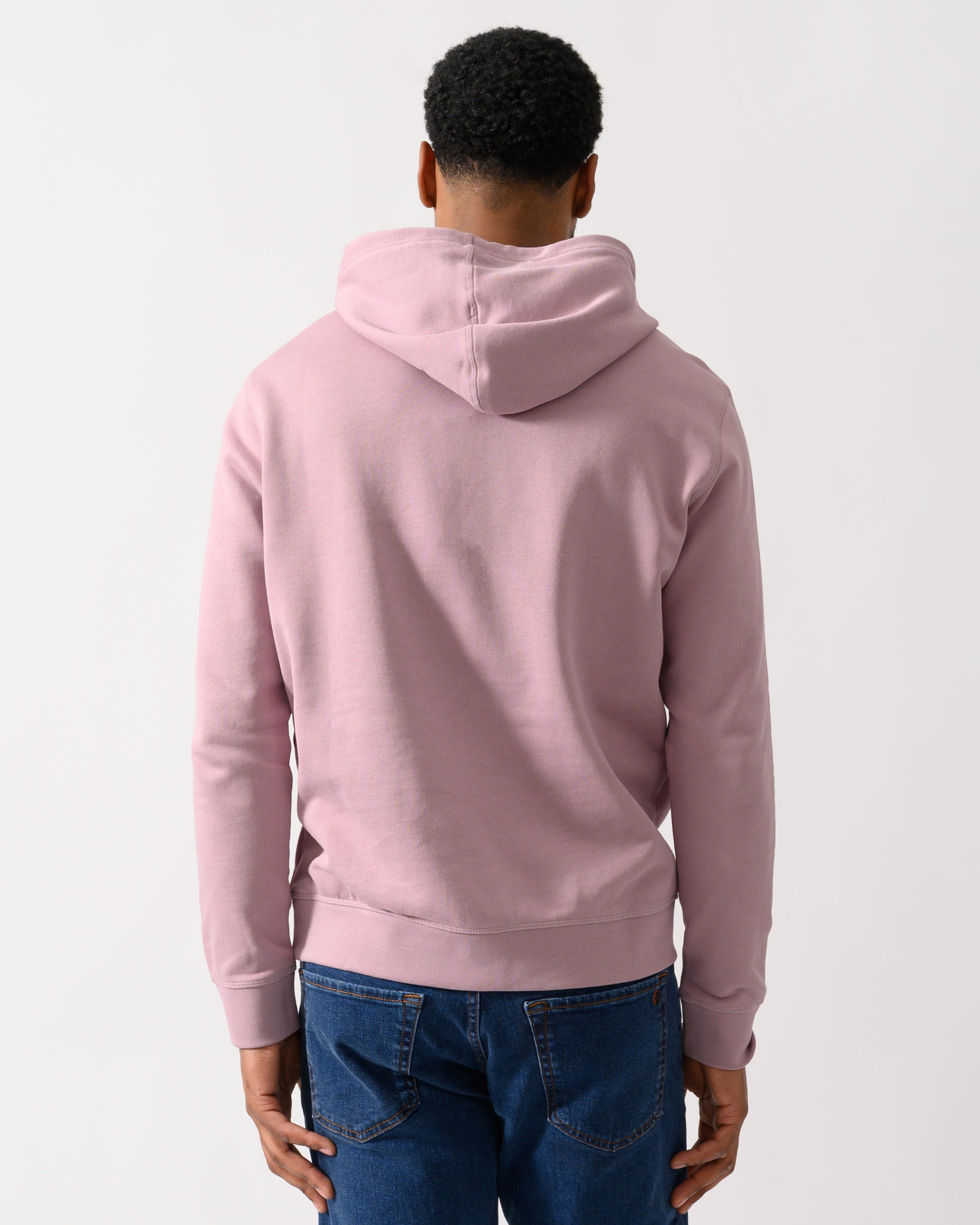 back shot of a Model wearing a BOSS Orange Wetalk Mens Pullover Hoodie With Logo Patch in Light/Pastel Purple