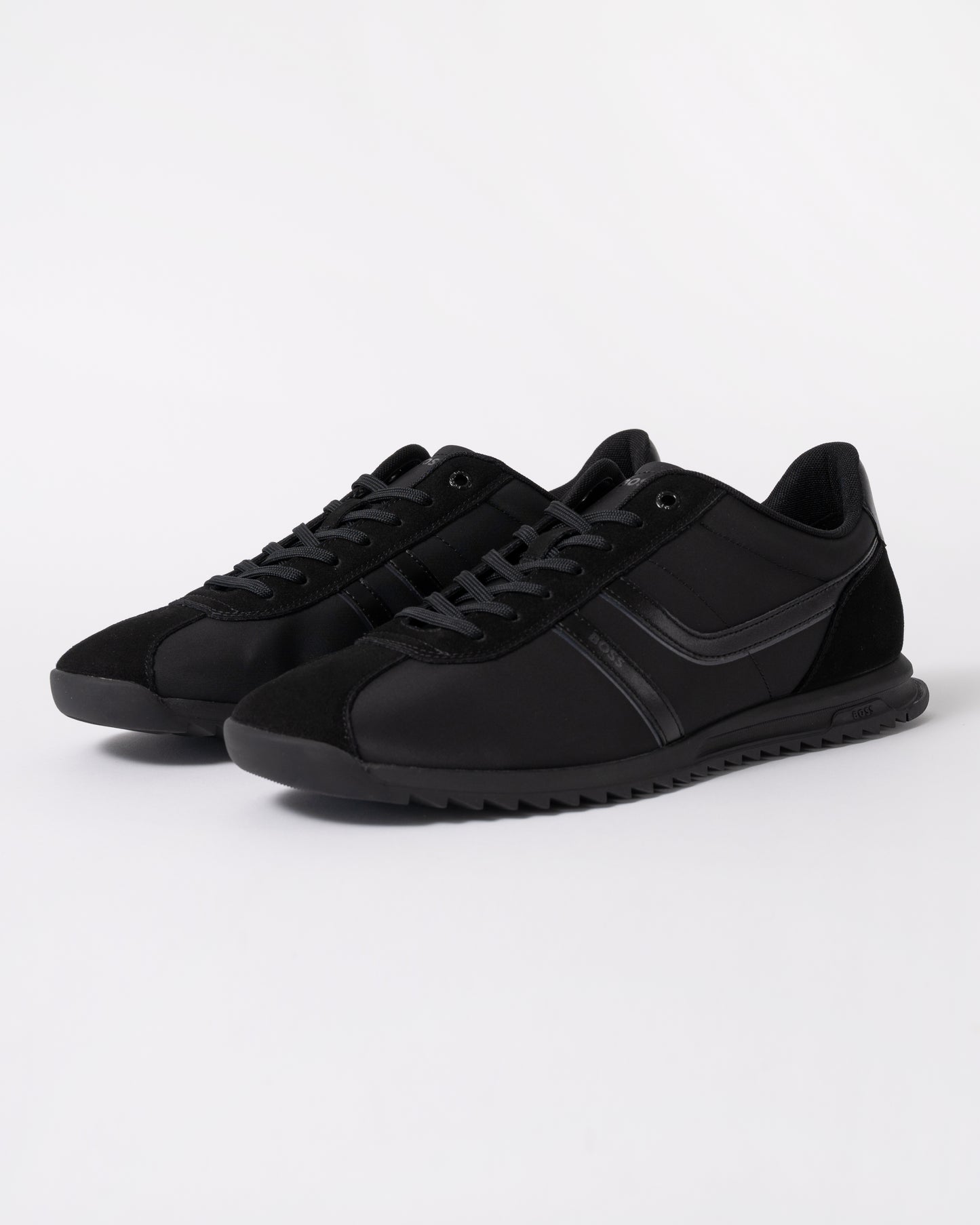 a pair of BOSS Orange Zayn Mens Logo Trainers with Faux Suede Trims in Black 005