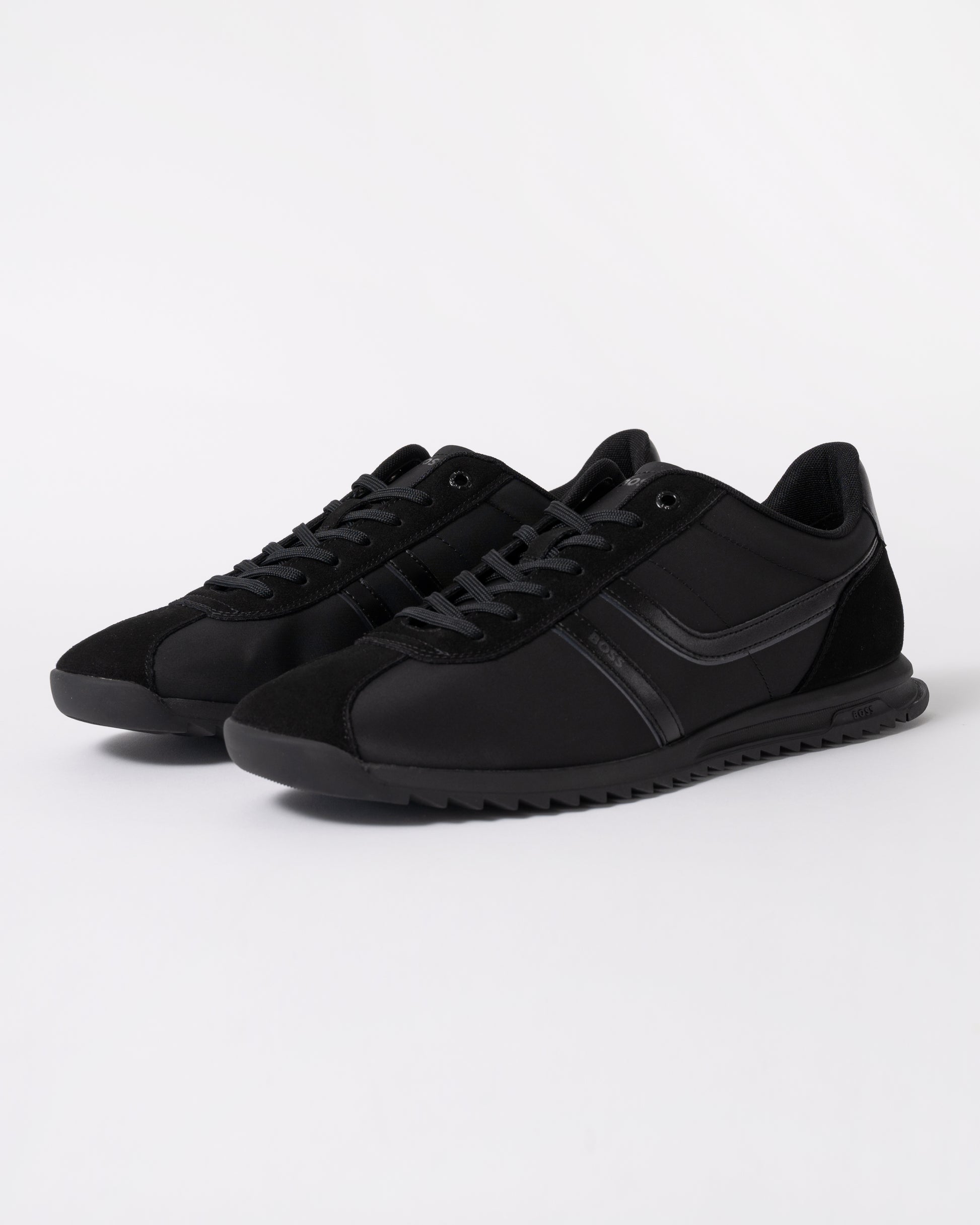 a pair of BOSS Orange Zayn Mens Logo Trainers with Faux Suede Trims in Black 005