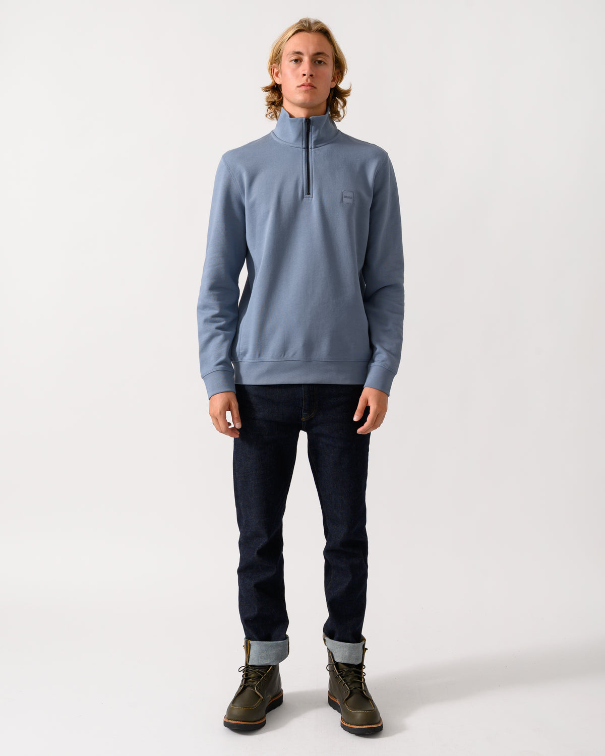 full length of a model wearing a BOSS Orange Zetrust Mens 1/4 Zip Sweatshirt in Medium Blue 424