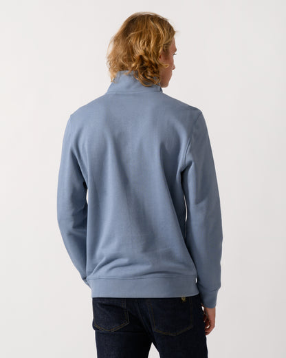 back of model wearing a BOSS Orange Zetrust Mens 1/4 Zip Sweatshirt in Medium Blue 424