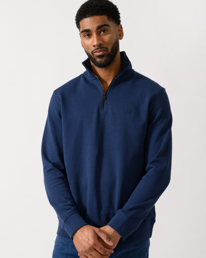 Model wearing a BOSS Orange Zetrust Mens 1/4 Zip Sweatshirt in Open Blue