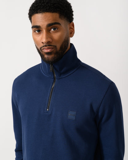 detail shot of a Model wearing a BOSS Orange Zetrust Mens 1/4 Zip Sweatshirt in Open Blue
