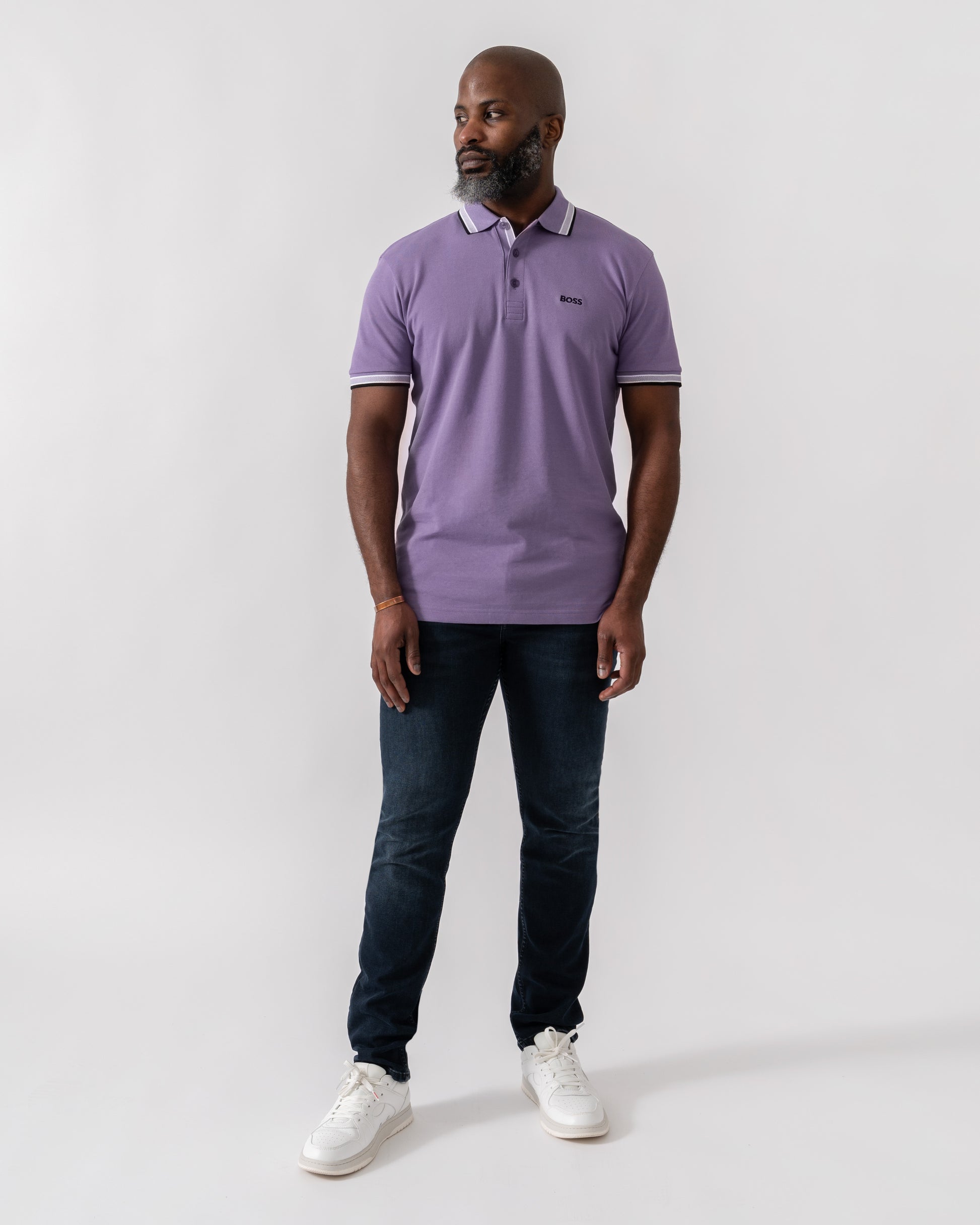 Model wearing BOSS Green Paddy Mens Cotton-Piqué Polo Shirt with Contrast Logo in Bright Purple 521 - Full Length
