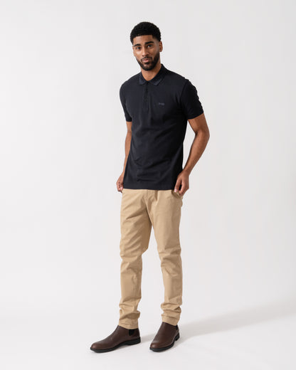 Model wearing BOSS Green Mens Paddy Cotton-Piqué Polo Shirt with Contrast Logo in Dark Blue 408 - Full length