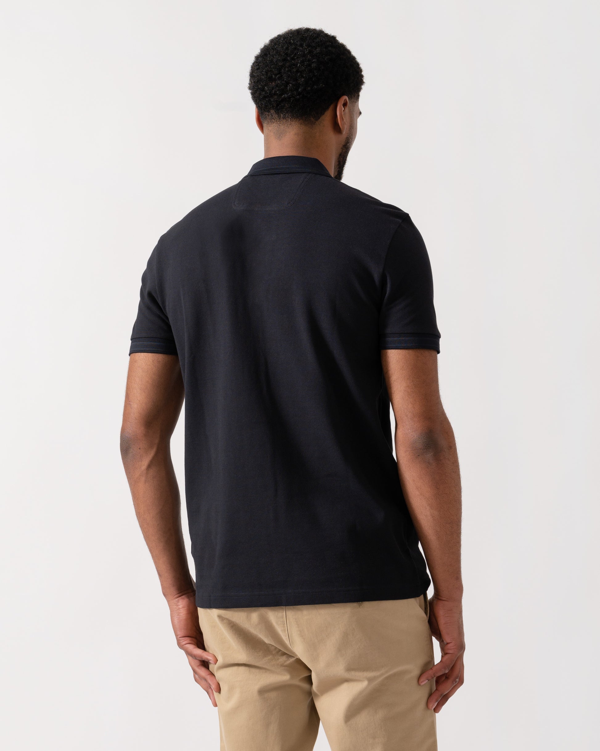 Model wearing BOSS Green Mens Paddy Cotton-Piqué Polo Shirt with Contrast Logo in Dark Blue 408 - back