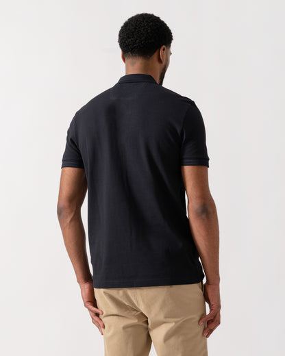 Model wearing BOSS Green Mens Paddy Cotton-Piqué Polo Shirt with Contrast Logo in Dark Blue 408 - back