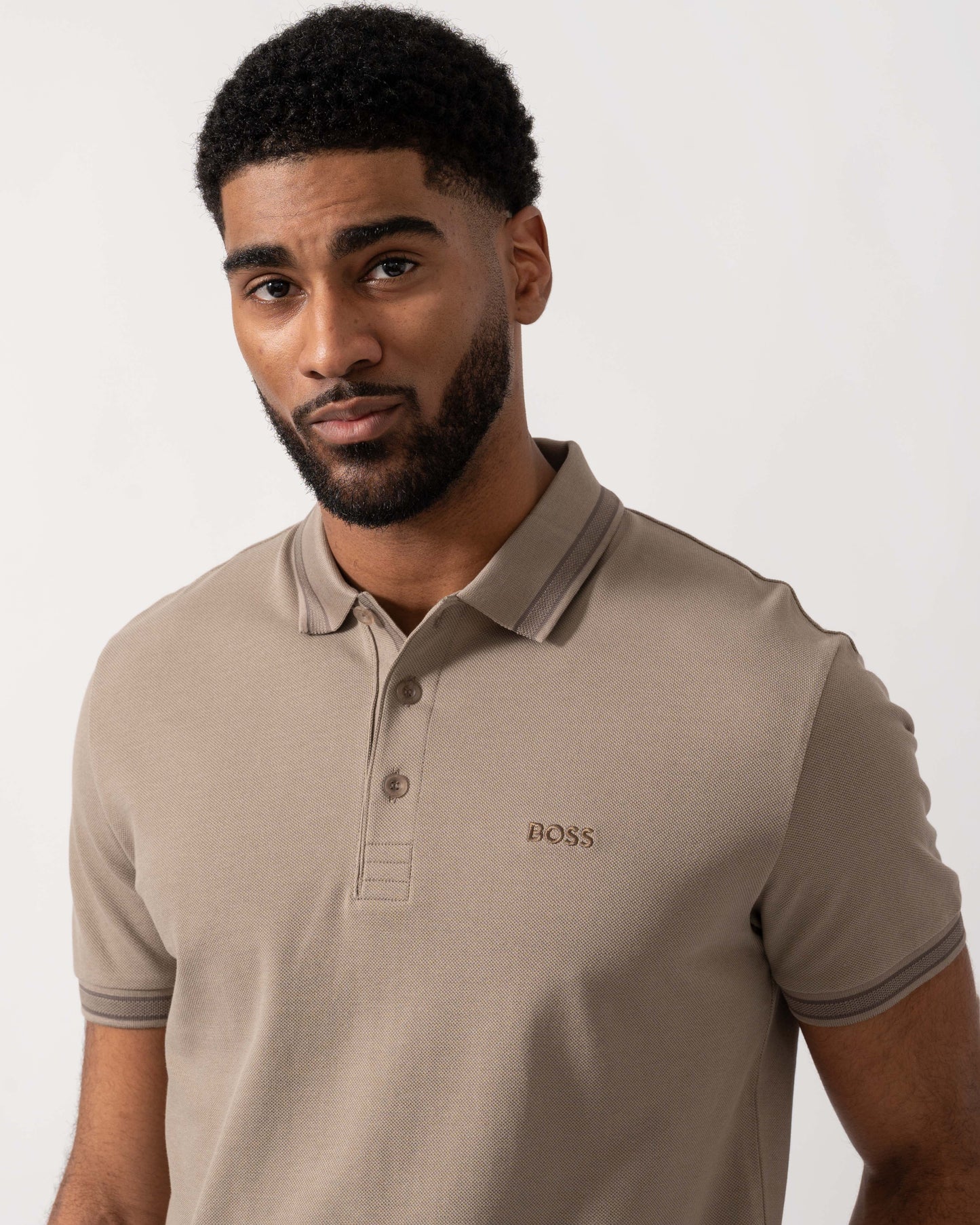 Model wearing BOSS Green Mens Paddy Cotton-Piqué Polo Shirt with Contrast Logo in Light/Pastel Green 339 - detail