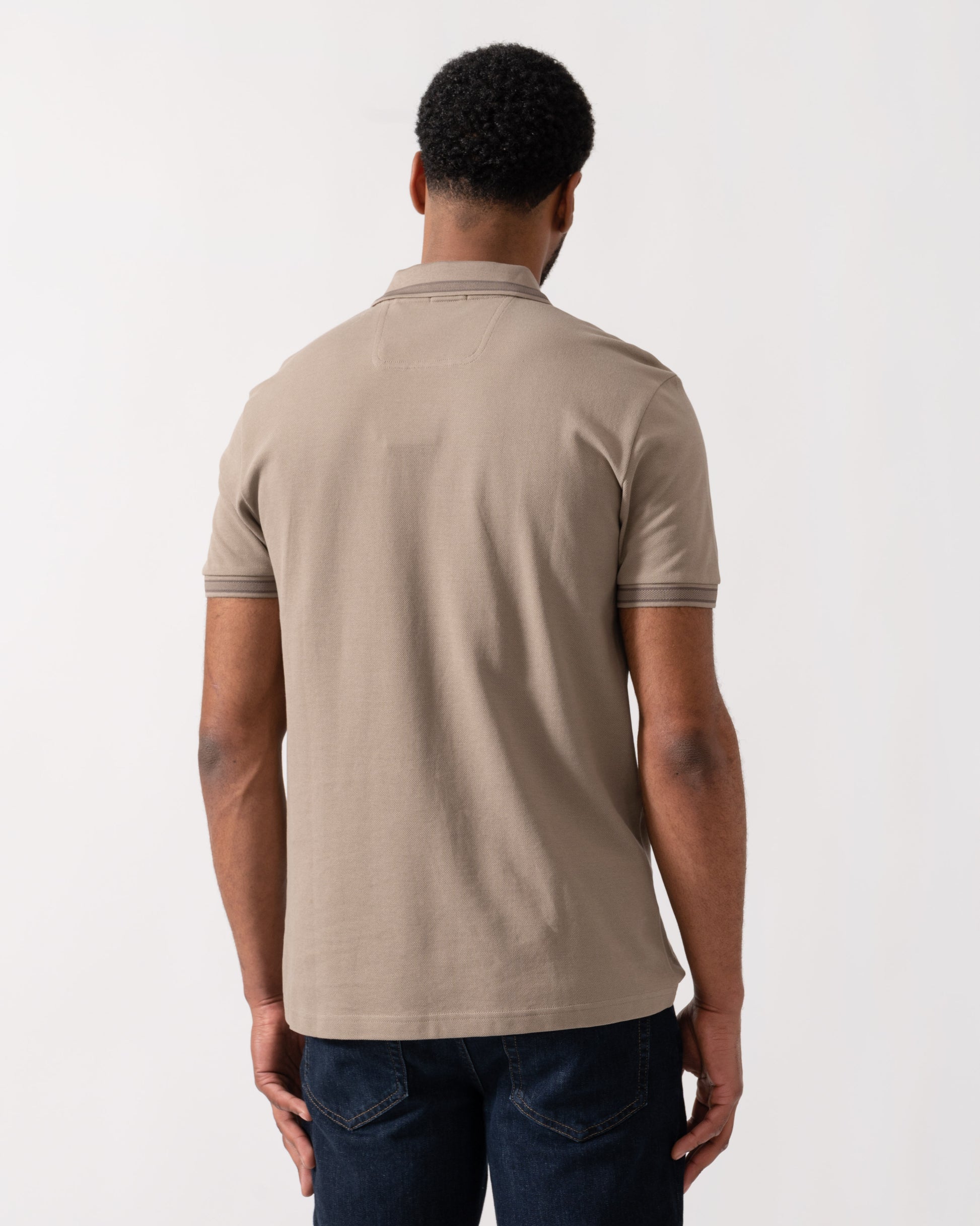 Model wearing BOSS Green Mens Paddy Cotton-Piqué Polo Shirt with Contrast Logo in Light/Pastel Green 339 - back