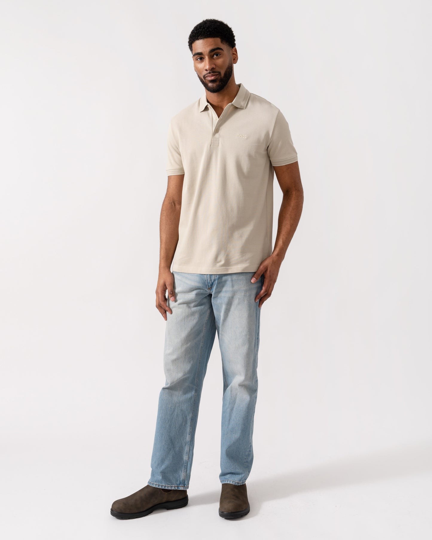 Model wearing BOSS Green Mens Paddy Cotton-Piqué Polo Shirt with Contrast Logo in Light Beige 275 - Full Length