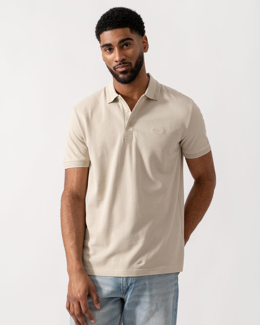 Model wearing BOSS Green Mens Paddy Cotton-Piqué Polo Shirt with Contrast Logo in Light Beige 275 - Main