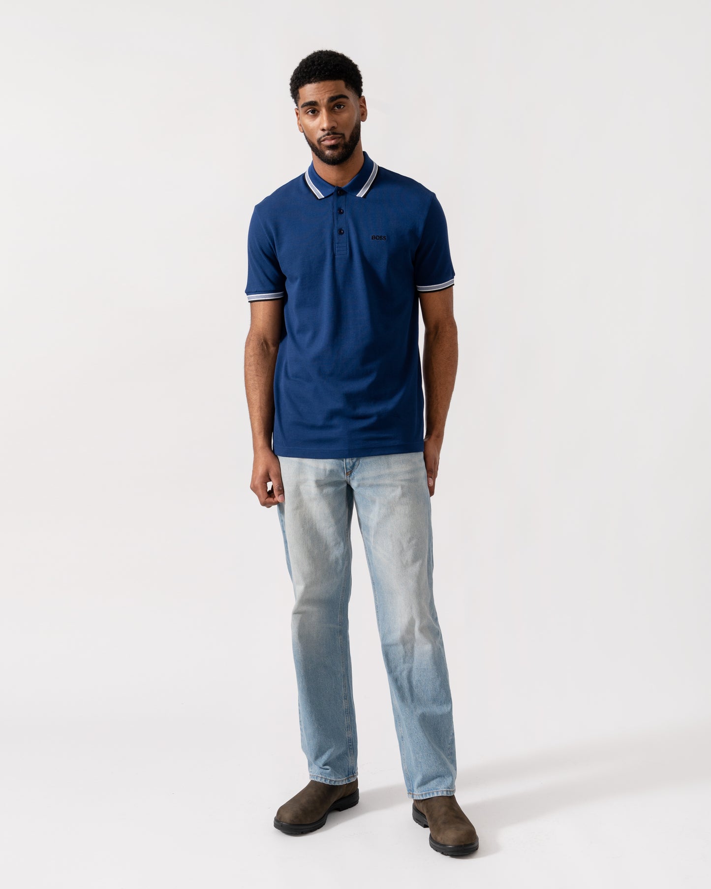 Model wearing BOSS Green Mens Paddy Cotton-Piqué Polo Shirt with Contrast Logo in Navy 419 - Full Length