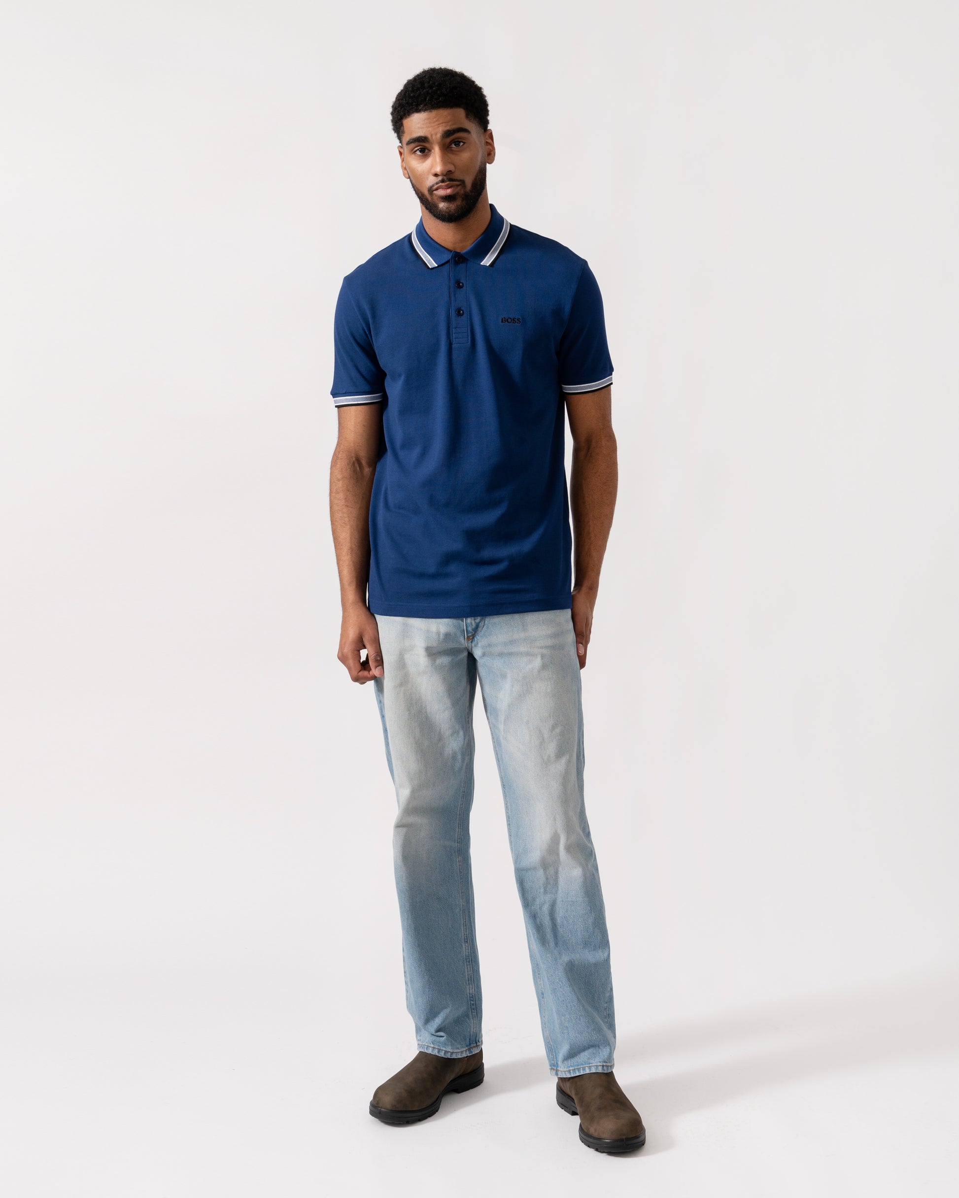 Model wearing BOSS Green Mens Paddy Cotton-Piqué Polo Shirt with Contrast Logo in Navy 419 - Full Length