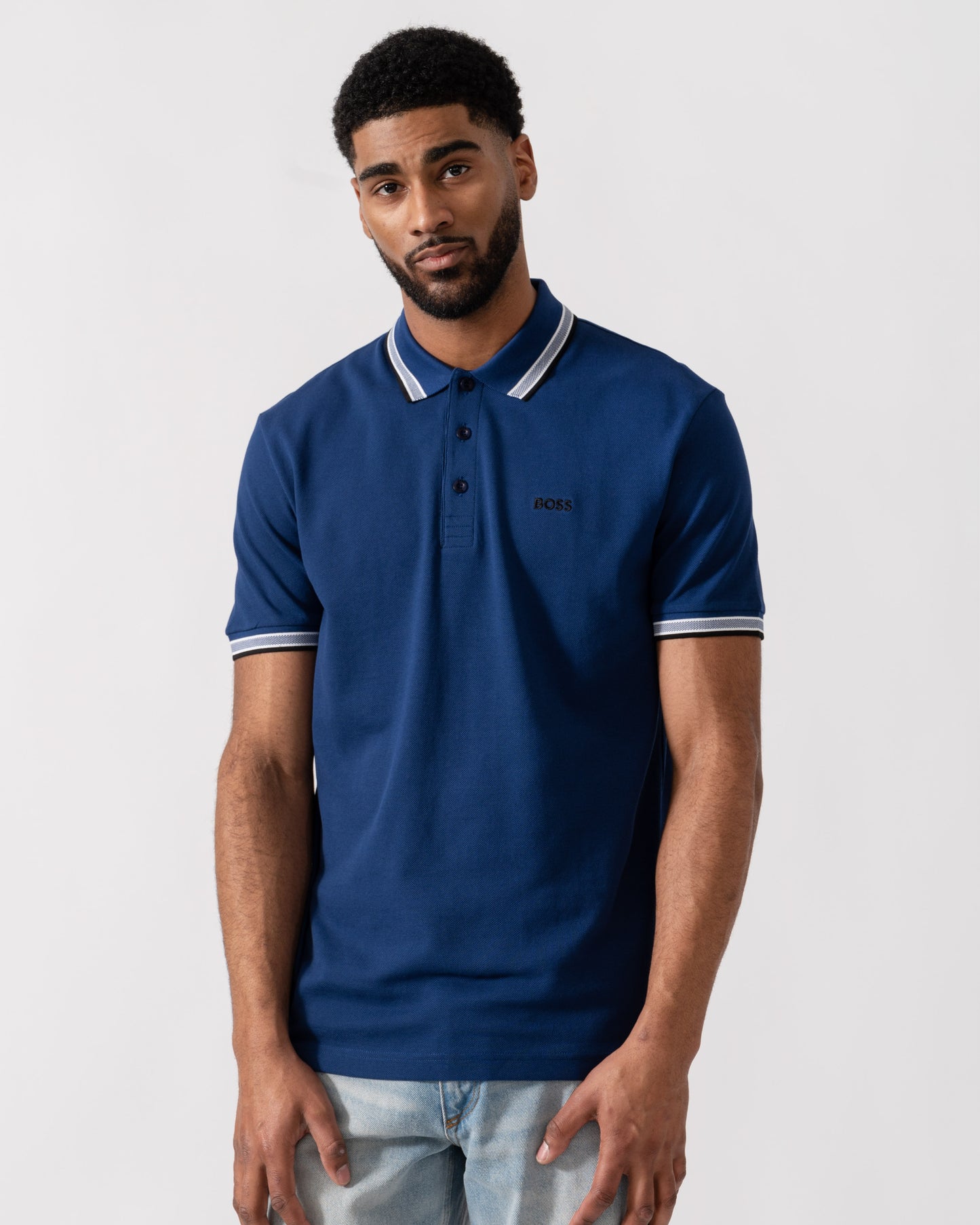 Model wearing BOSS Green Mens Paddy Cotton-Piqué Polo Shirt with Contrast Logo in Navy 419 - Main