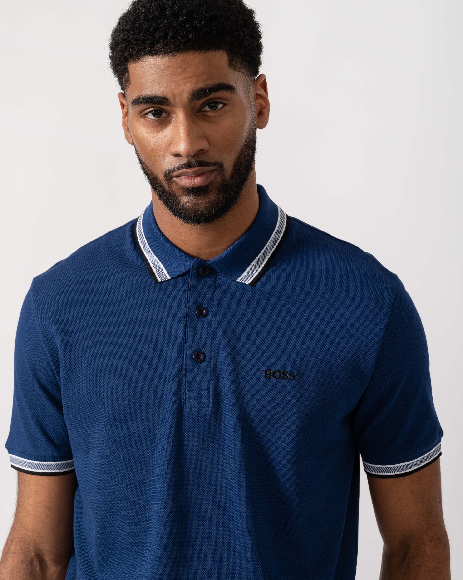 Model wearing BOSS Green Mens Paddy Cotton-Piqué Polo Shirt with Contrast Logo in Navy 419 - Detail