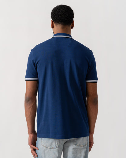 Model wearing BOSS Green Mens Paddy Cotton-Piqué Polo Shirt with Contrast Logo in Navy 419 - back