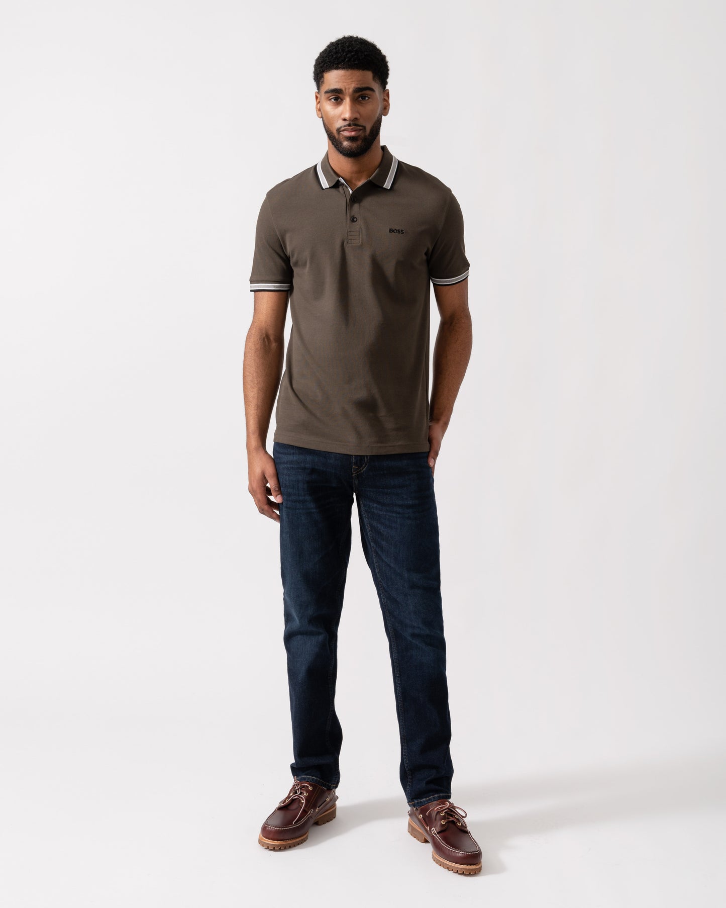 Model wearing BOSS Green Mens Paddy Cotton-Piqué Polo Shirt with Contrast Logo in Open Beige 297 - Full length
