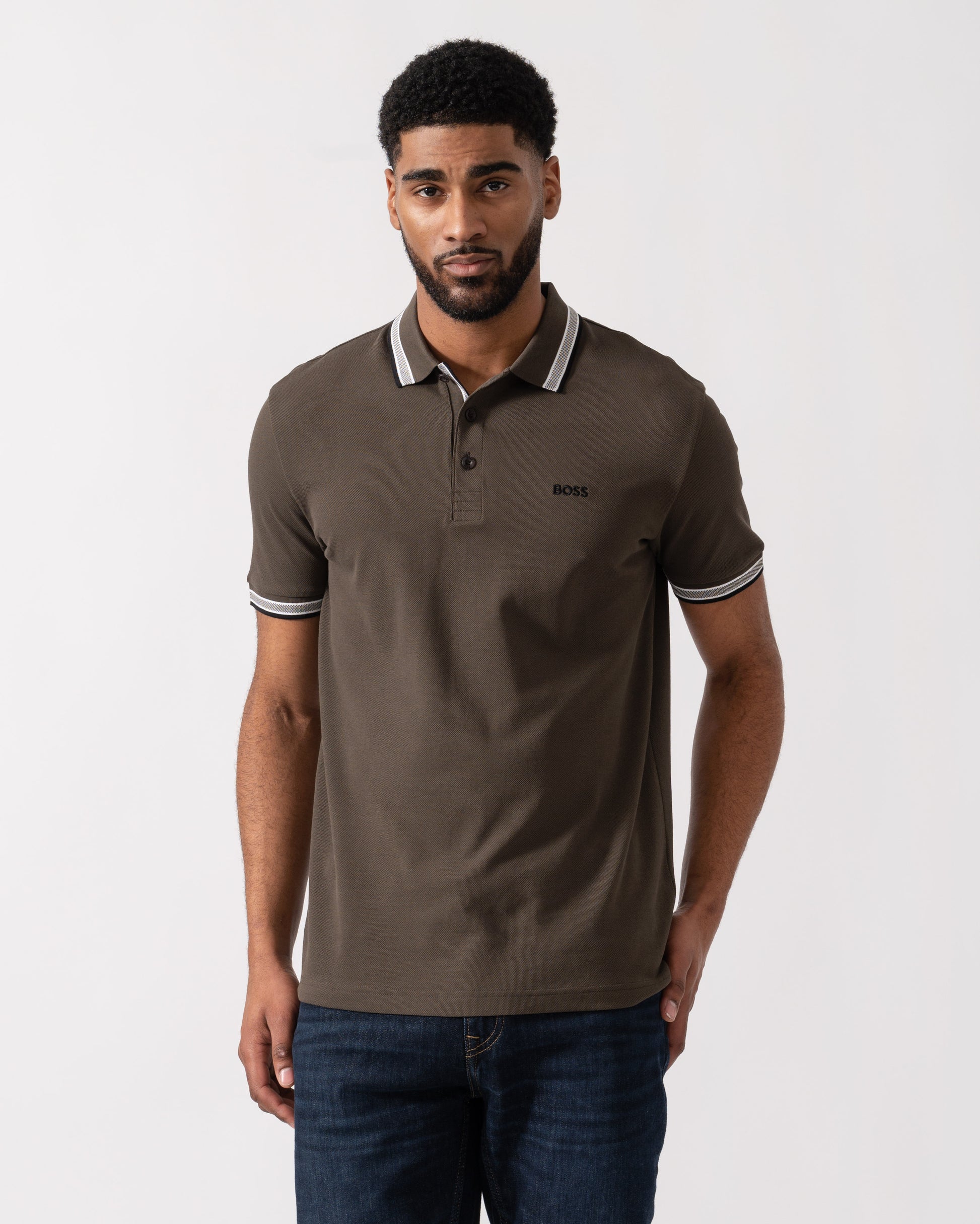 Model wearing BOSS Green Mens Paddy Cotton-Piqué Polo Shirt with Contrast Logo in Open Beige 297 - main
