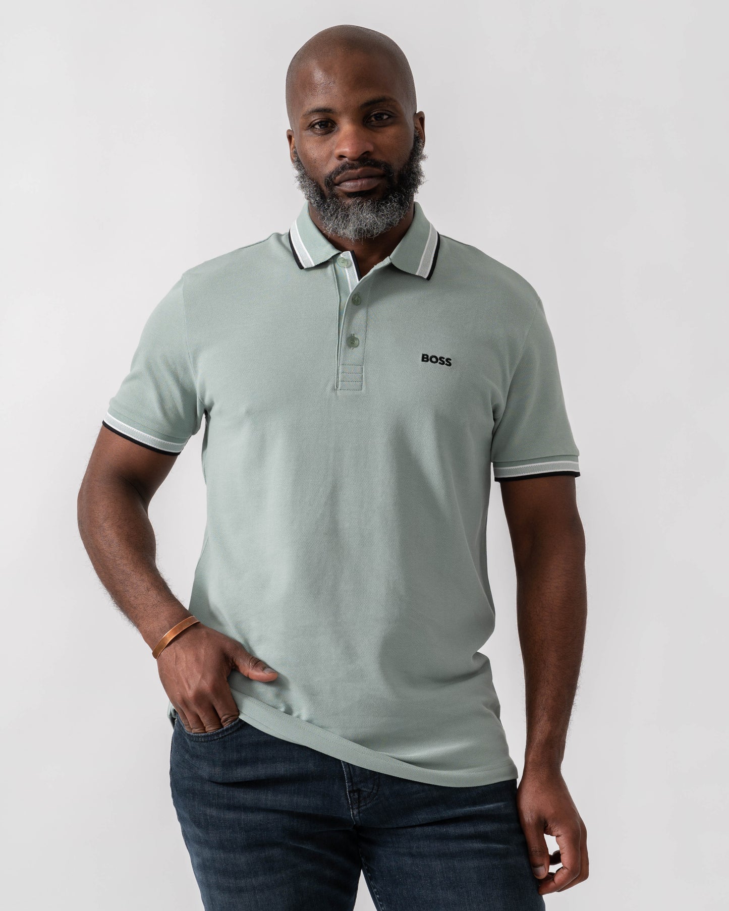 Model wearing BOSS Green Paddy Mens Cotton-Piqué Polo Shirt with Contrast Logo in Open Green 360 - Main