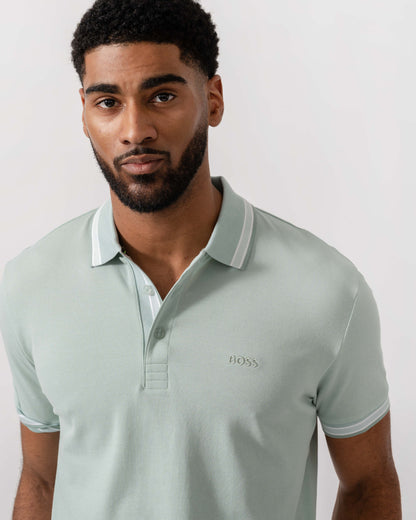 Model wearing BOSS Green Mens Paddy Cotton-Piqué Polo Shirt with Contrast Logo in Turquoise/Aqua 448 - Detail
