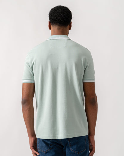 Model wearing BOSS Green Mens Paddy Cotton-Piqué Polo Shirt with Contrast Logo in Turquoise/Aqua 448 - Back