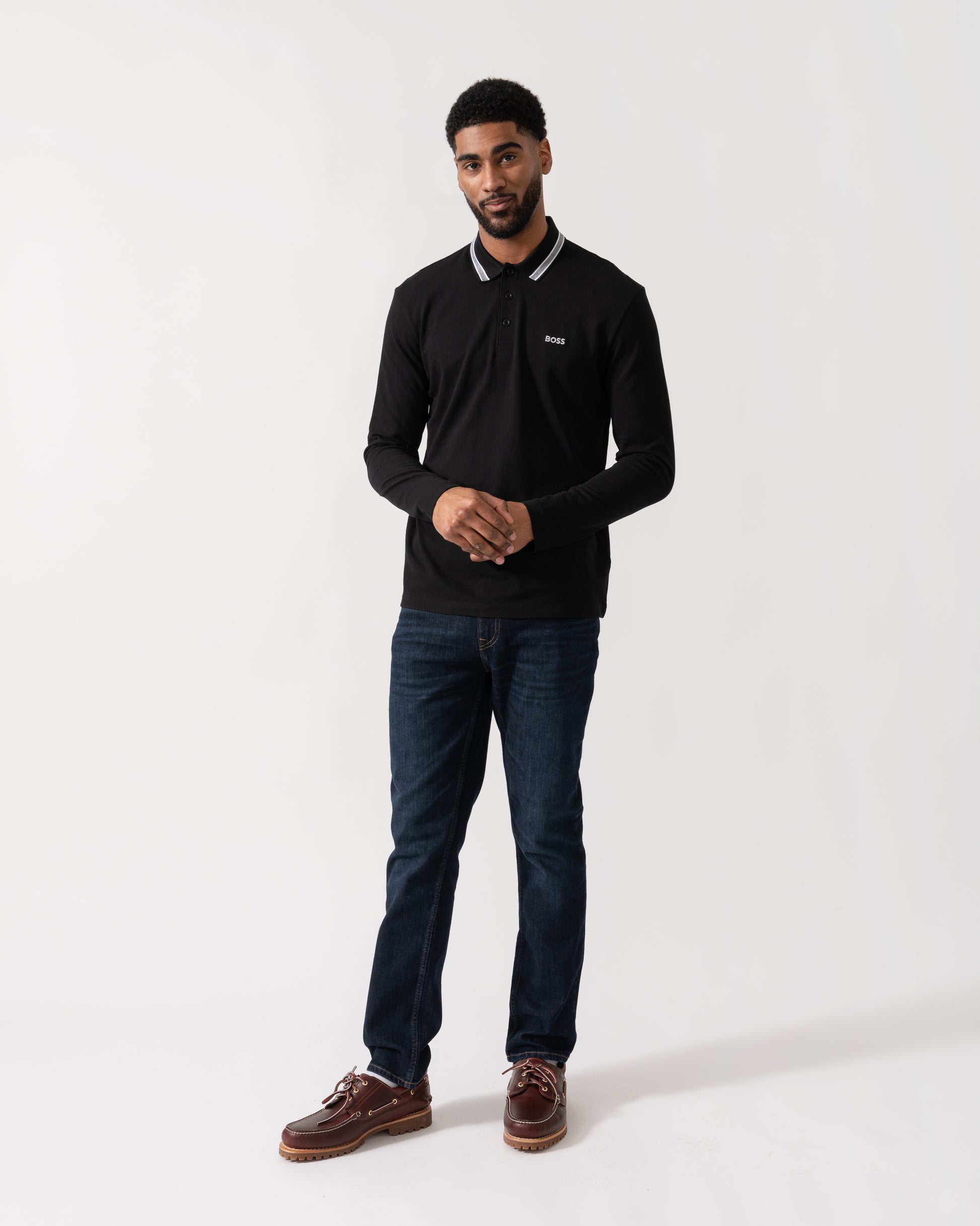 Model wearing BOSS Green Mens Plisy Long Sleeve Polo Shirt in Black 001 - full length