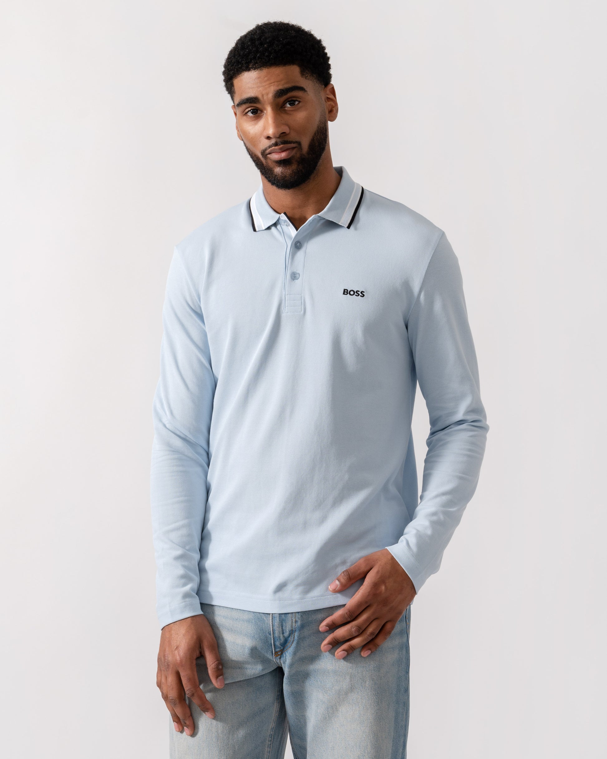 Model wearing BOSS Green Mens Plisy Long Sleeve Polo Shirt in Open Blue 464 - Main