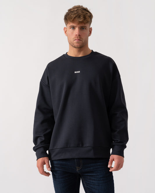 Model wearing BOSS Green Stenson Mens Crew Neck Sweatshirt in Dark Blue 403 - Main