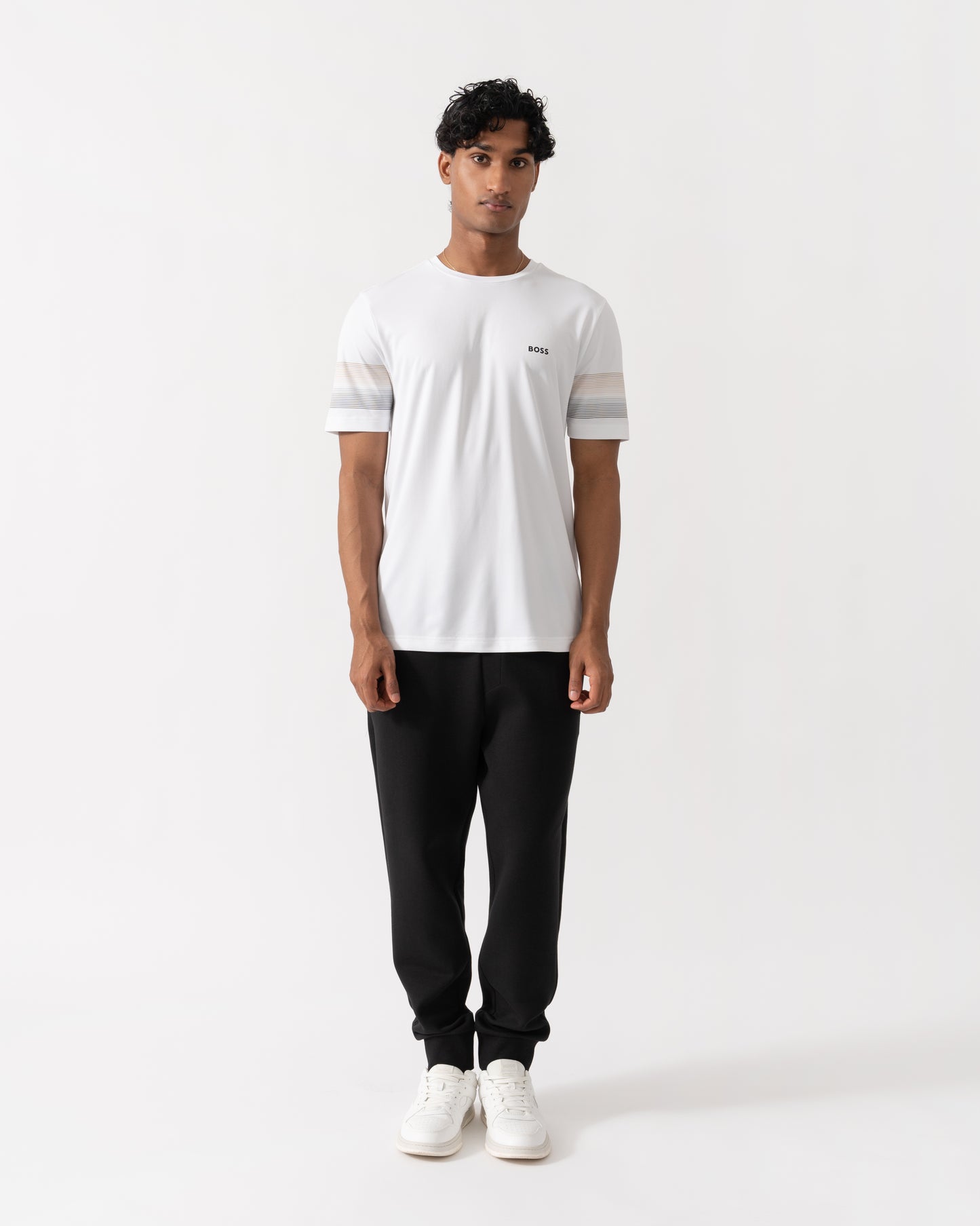Man wearing BOSS Green Hadiko Mens Stretch-cotton track pants with puff-print logo - Black 001