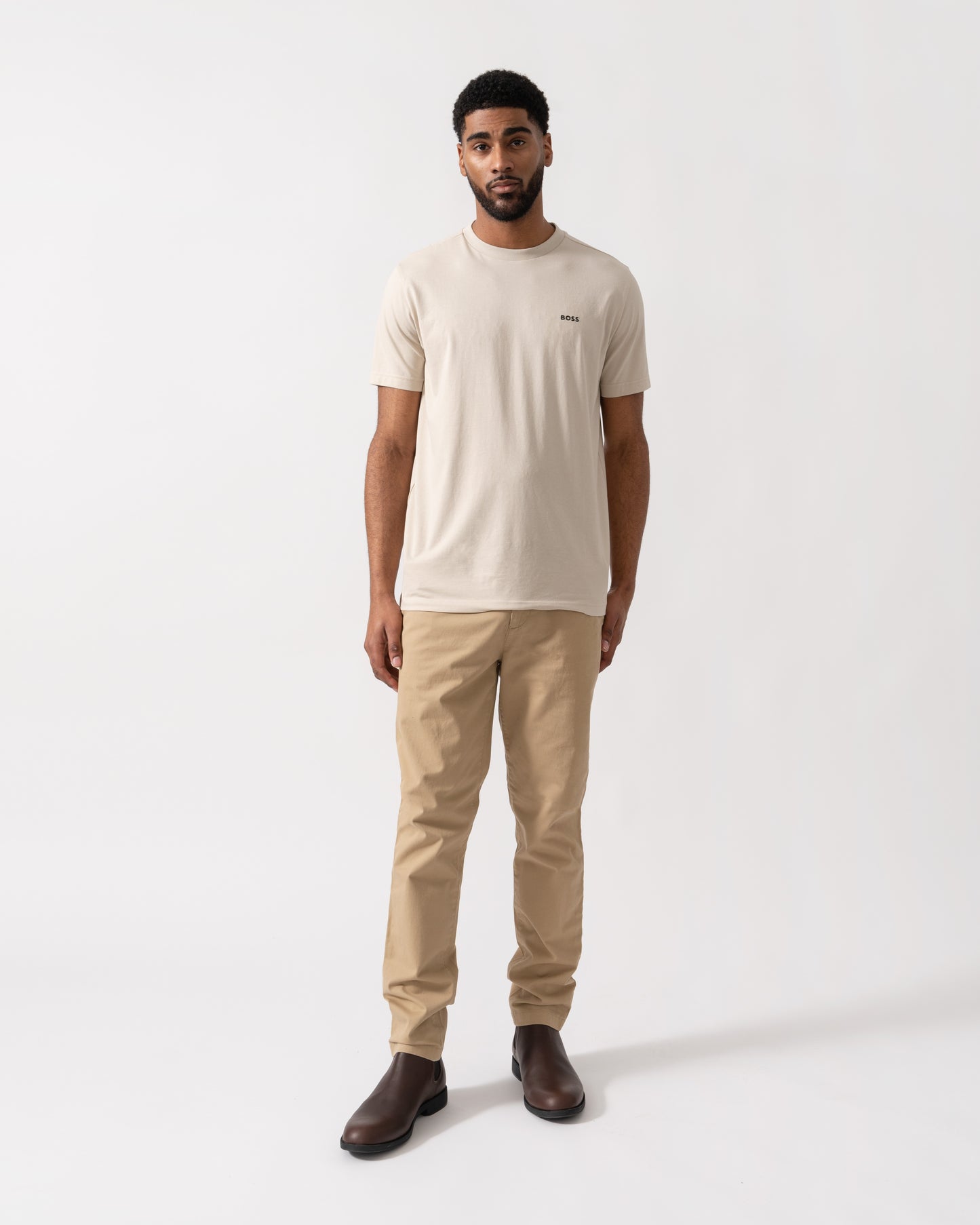 Model wearing BOSS Green Mens Tee Stretch Cotton T-Shirt with Contrast Logo in Light Beige 275 - full length