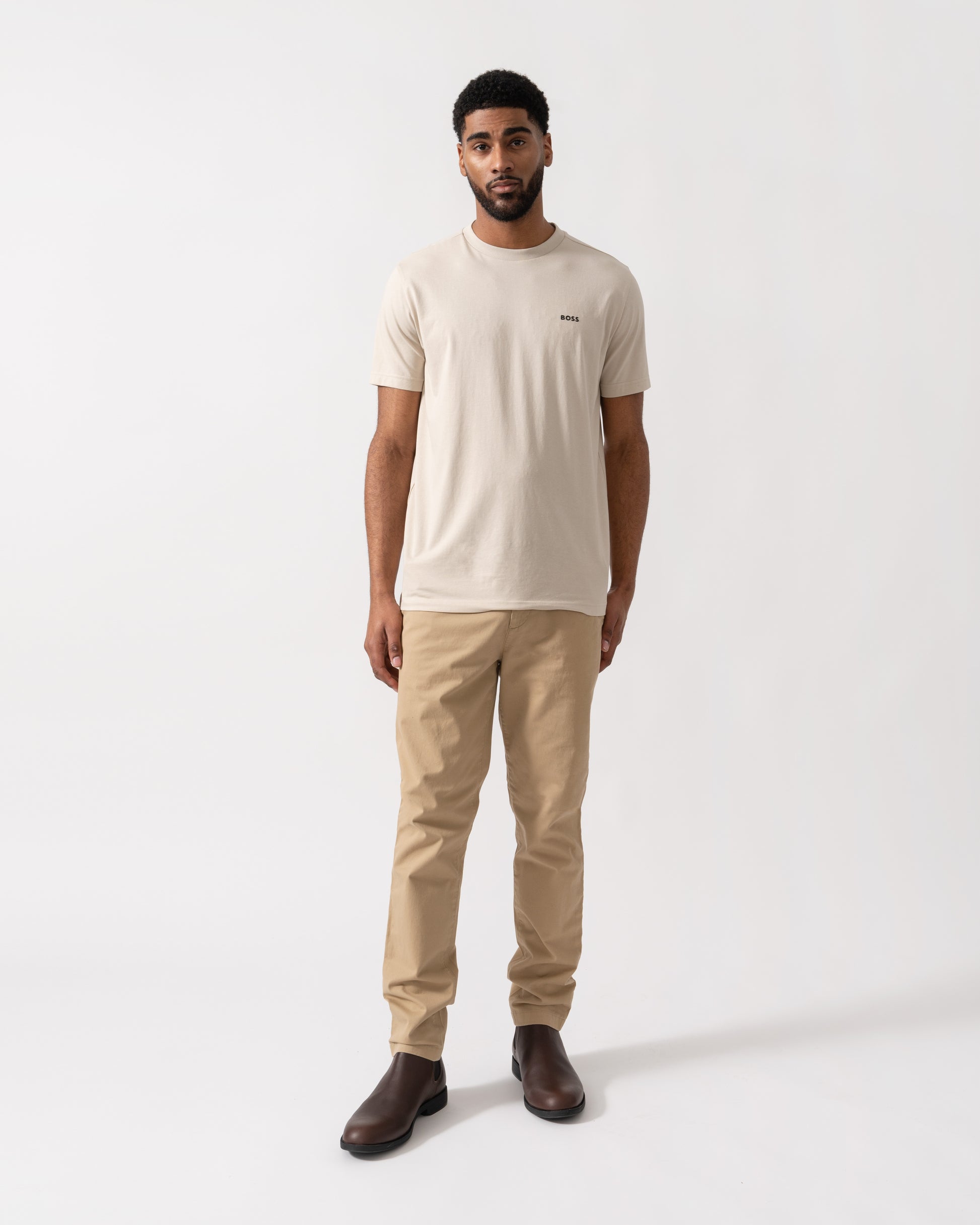 Model wearing BOSS Green Mens Tee Stretch Cotton T-Shirt with Contrast Logo in Light Beige 275 - full length