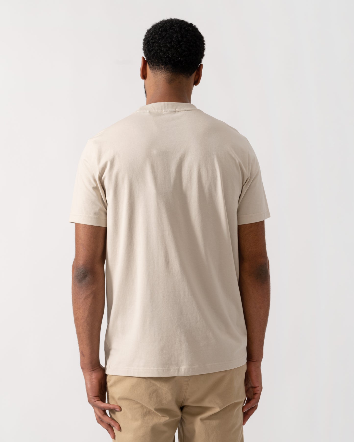 Model wearing BOSS Green Mens Tee Stretch Cotton T-Shirt with Contrast Logo in Light Beige 275 -  back