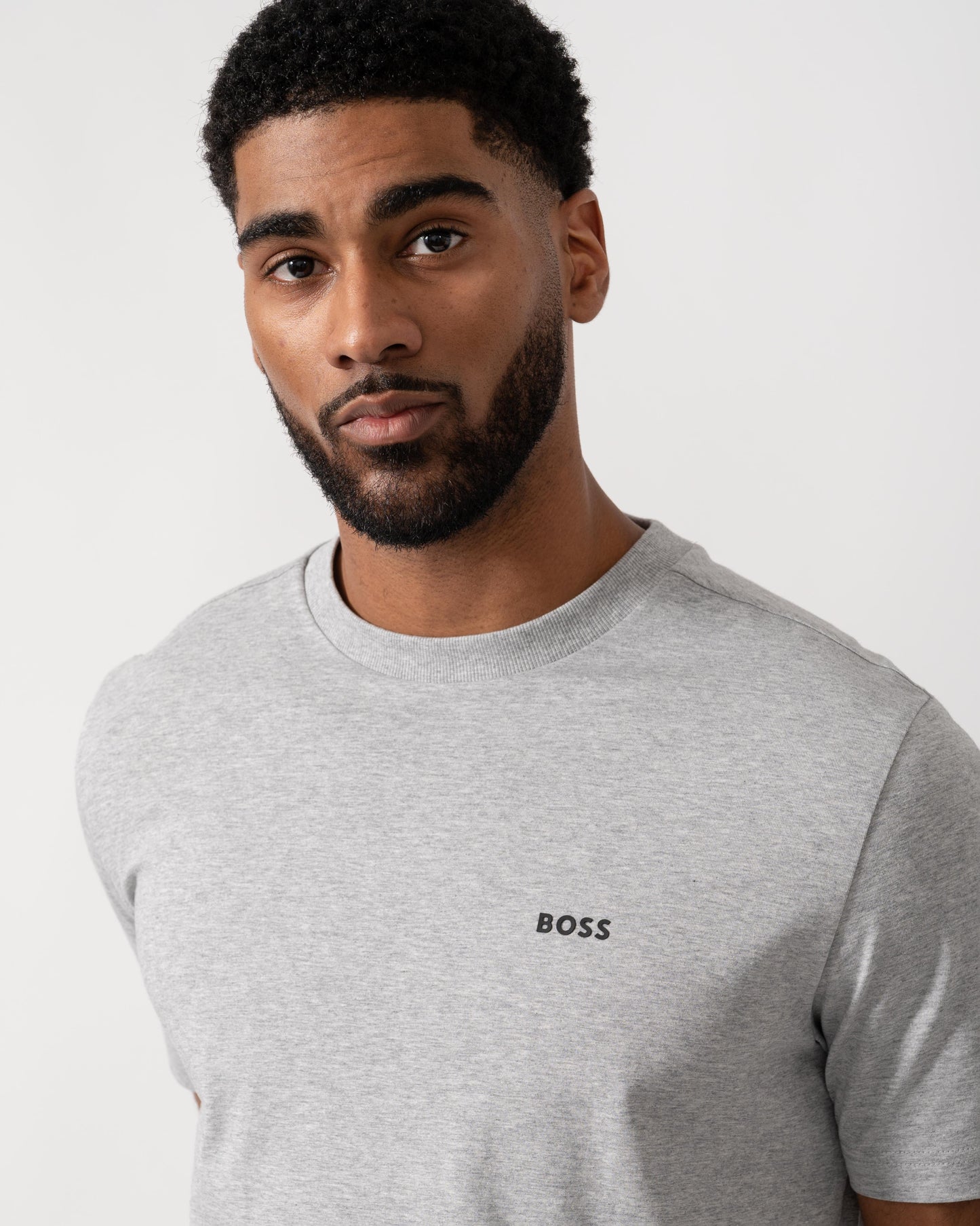 Model wearing BOSS Green Mens Tee Stretch Cotton T-Shirt with Contrast Logo in Silver 043 - Detail