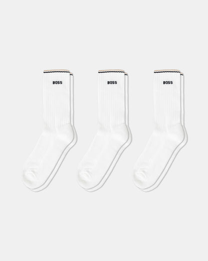 Three pairs of white socks with 'BOSS' branding on a white background