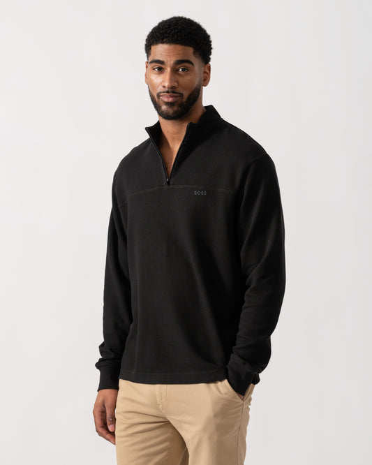 Model wearing BOSS Orange Hive Mens 1/4 Zip Sweatshirt in Black 001 - Main