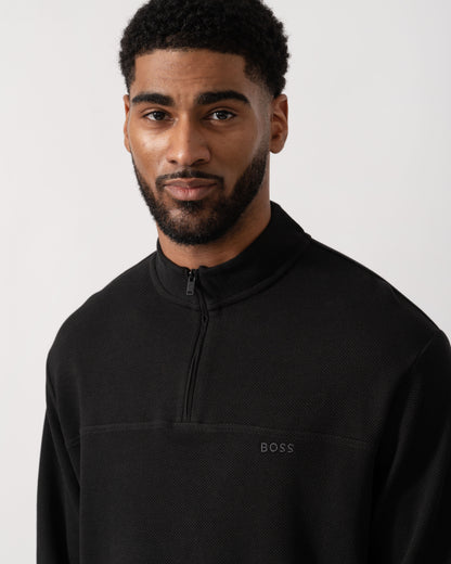 Model wearing BOSS Orange Hive Mens 1/4 Zip Sweatshirt in Black 001 - detail